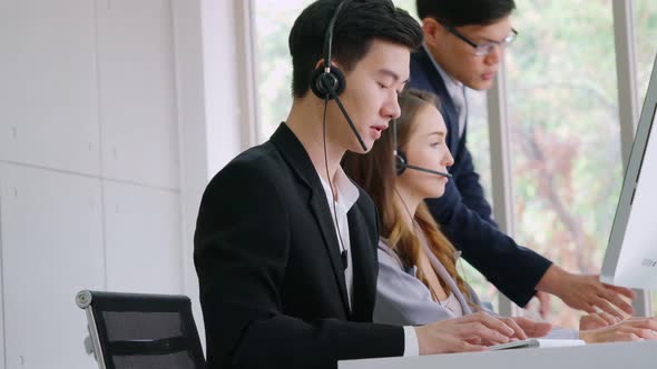 Business People Wearing Headset Working in Office