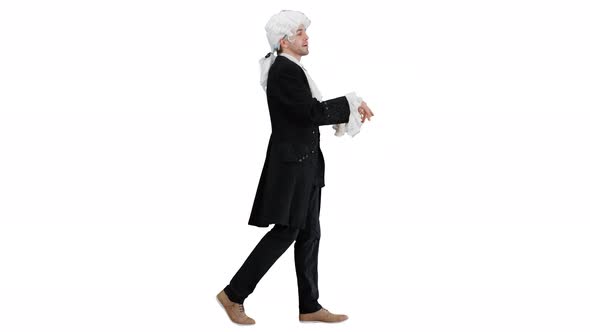 Man Dressed As Courtier Talking Expressively and Waiving His Hands While Walking and Looking at