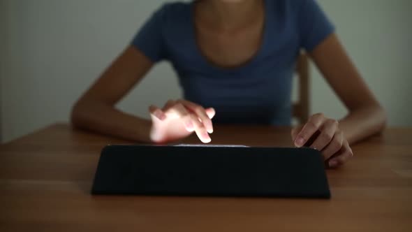 Woman working on tablet computer