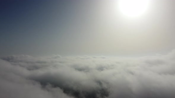 High Above the Thick Fog Like Beautiful Ocean of Clouds at Sunrise