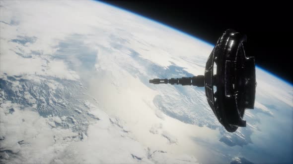 Futuristic Space Satellite Orbiting the Earth alt