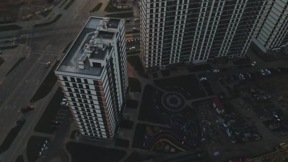 City block construction site. Multi-storey buildings. City landscape at sunrise. Aerial photography.