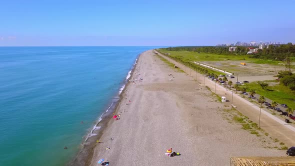 Aerial view on beach and umbrellas. Beach and blue water.