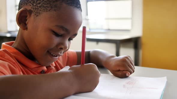 Boy studying in classroom