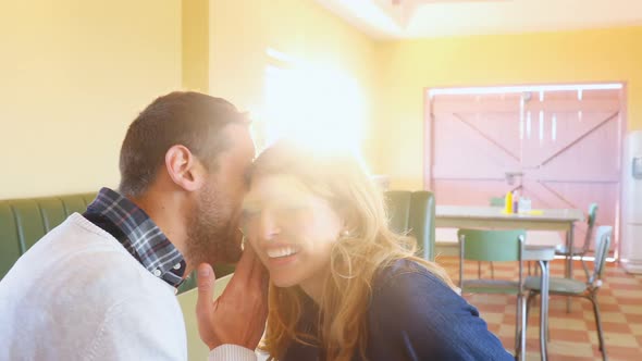 Man whispering in womans ear 4k