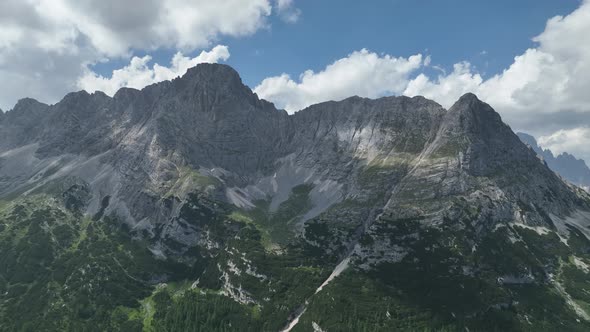 Hikers and travelers enjoy the beautiful mountain views as they have a walk in the Dolomites