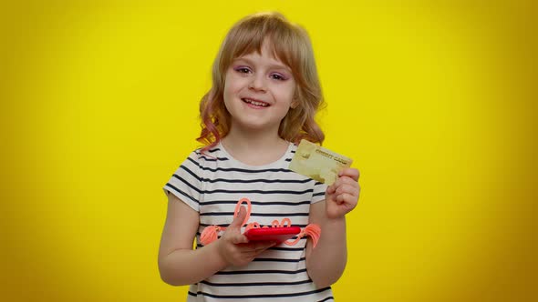 Little Teen Kid Child Girl Using Credit Bank Card and Mobile Phone While Purchases Online Shopping