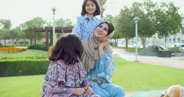 Mom and daughters at the park