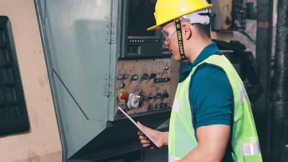 Smart Factory Worker Using Machine in Factory Workshop