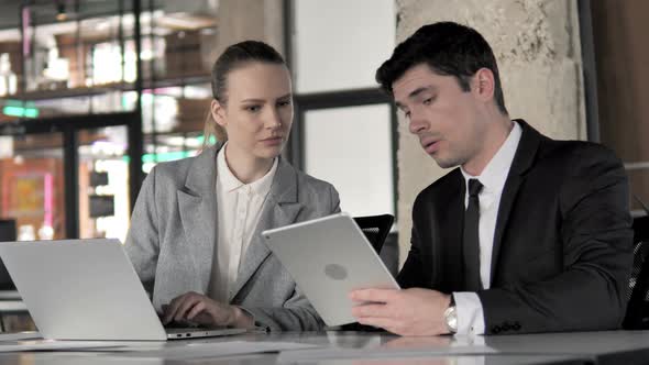 Business People Working on Laptop and Tablet