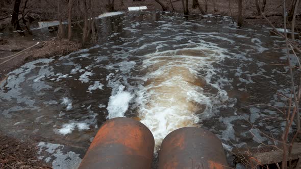 Discharge of Sewage Into a River. Dirty Sewage From the Pipe, Environmental Pollution