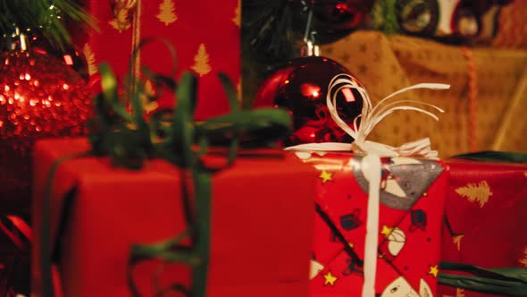 Christmas Tree and Christmas Gift Boxes in the Interior with a Fireplace 