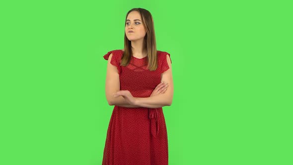 Tender Girl in Red Dress Is Waiting. Green Screen