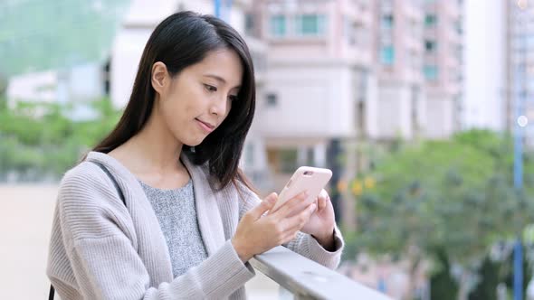 Asian Woman use of cellphone 