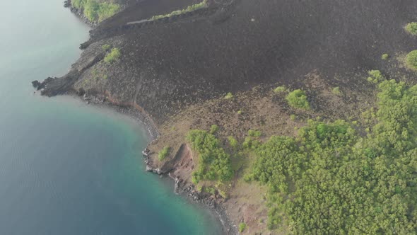 Aerial: flying over Banda Islands active volcano Gunung Api lava flows Maluku 