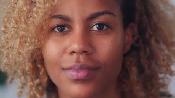 Closeup Camera View of Young Blonde African American Woman Looking at Camera