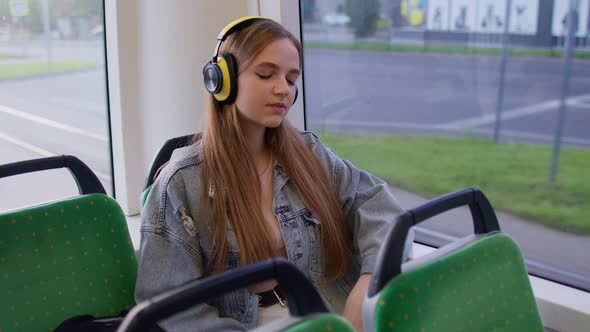 Young Woman Wearing Headphones Listening Music Funny Relax Dancing While Traveling By Bus to City