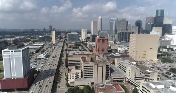 This video is an aerial of downtown Houston skyscrapers and surrounding area on a sunny day. This vi