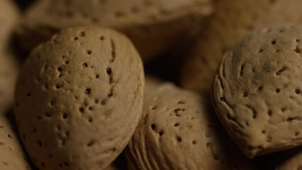 Cinematic, rotating shot of almonds on a white surface - ALMONDS 