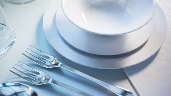 Elegant tableware at the restaurant. Dinner set at the wedding reception.Closeup