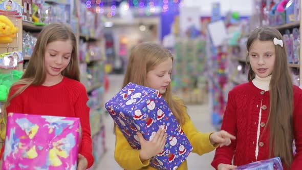 Happy Children with Gifts in Their Hands Children Rejoice in the New Year and Christmas