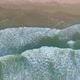 Top Down Aerial View Descending Low Above Powerful Waves Coming onto The Beach - VideoHive Item for Sale