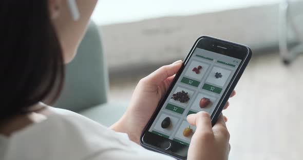Ordering Food Vegetables and Fruits Online Using Smartphone App Close Up