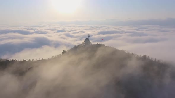 Mosque Above the Clouds at Sunrise