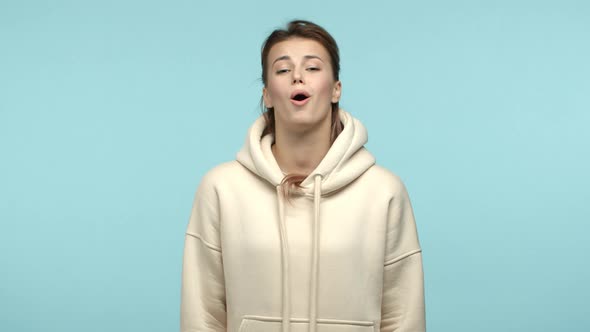 Slow Motion of Young Attractive Woman in Stylish Hoodie Nod in Approval and Saying Oh Yes Approve