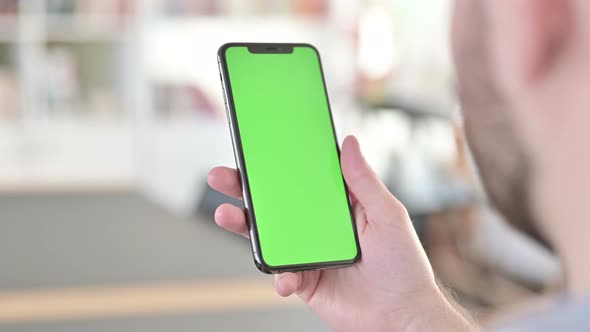 Man Using Smartphone with Chroma Key Screen