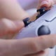 Person Holds a Controller for Game Console in Hands and Intensively and Nervously Presses Buttons - VideoHive Item for Sale