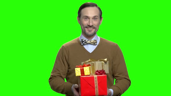 Handsome Pleasant Man Giving Present Boxes To You
