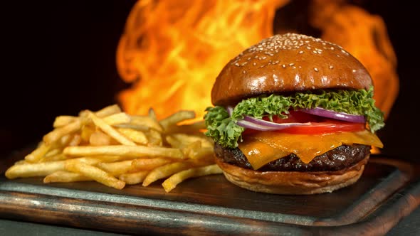 Super Slow Motion Shot of Hamburger, French Fries and Flames at 1000Fps.