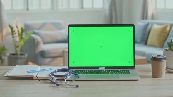 Doctor Computer Laptop With Green Screen At Home Office