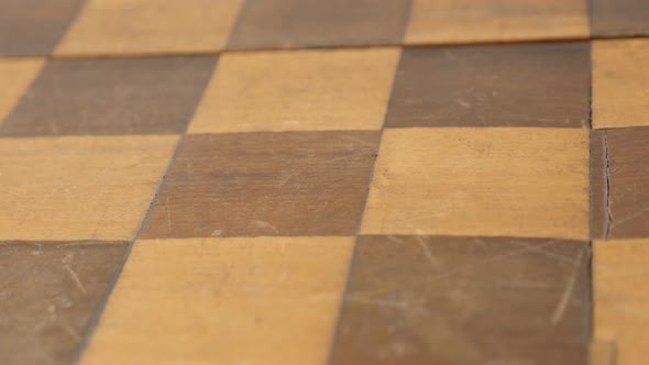 Tilting on ancient board game patina and  scratches 4K 2160p 30fps UltraHD  footage - Close-up woode