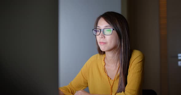 Woman work on computer at night