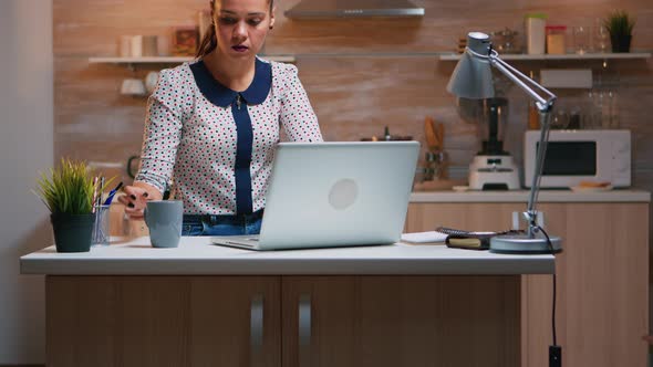 Business Woman Working From Home Drinking Coffee