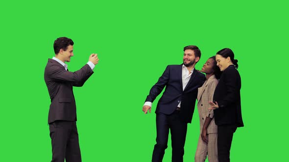 Young Attractive Smiling Office Workers Posing for a Picture on a Green Screen Chroma Key