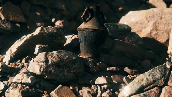 Old Metal Jug at Rocks alt