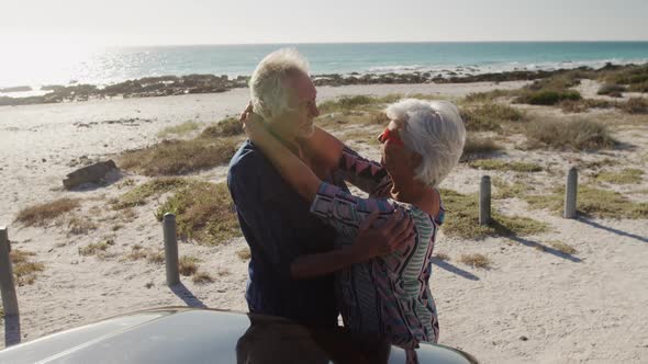 Senior couple hugging at the beach