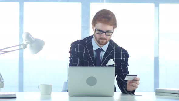 Redhead Businessman Busy in Online Shopping, Payment by Credit Card