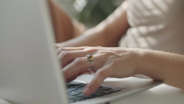 Young Woman Using Laptop at Home