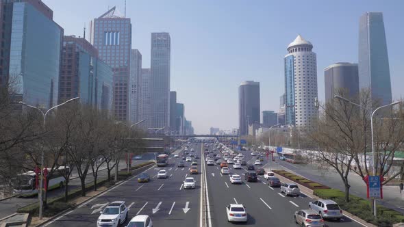 Central Business District in Beijing, China at Clear Day. Skyscrapers and Car Traffic on Road