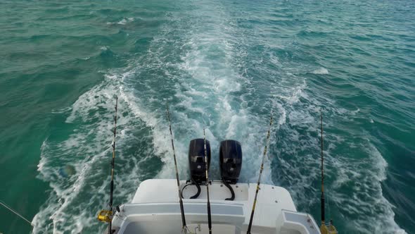 Motor Boat with Fishing Tackles Sailing in the Ocean