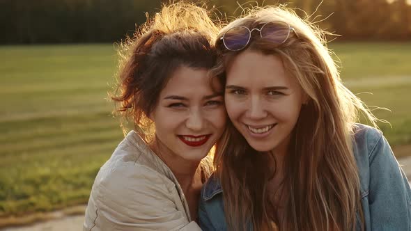 Females Embracing Laughing and Excited