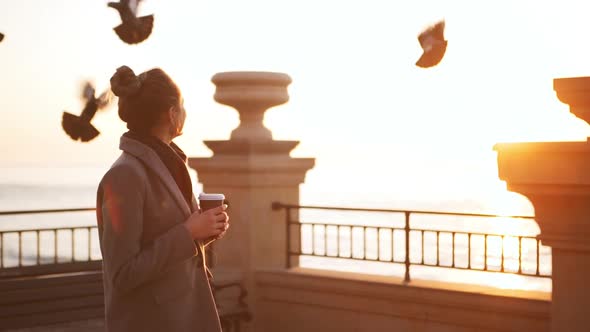 Goodlooking Young Girl Enjoying View of Sea at Sunrise in Slowmotion