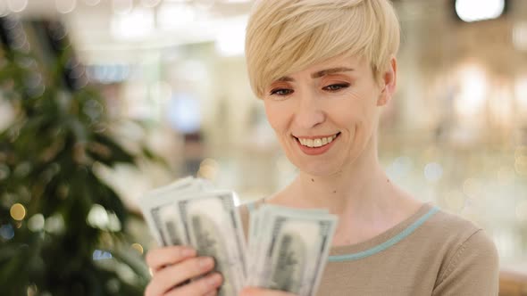 Successful Caucasian Middle Aged Woman Checking Amount Cash Money Happy with Financial Payment