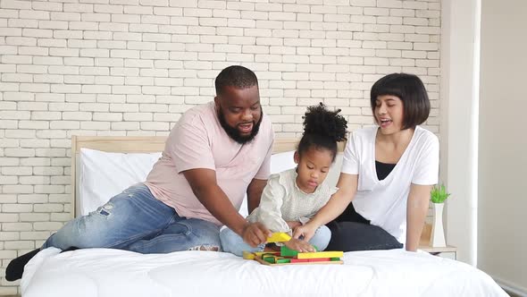 Happy african american family In the bedroom at home