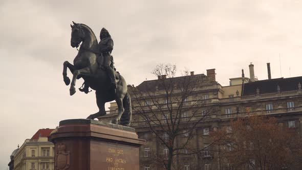 Statue of Warrior Riding a Horse With Ancestral Building at the Background in  Budapest Hungary - wi