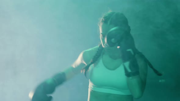 Young Female Boxer Doing Shadow Fight